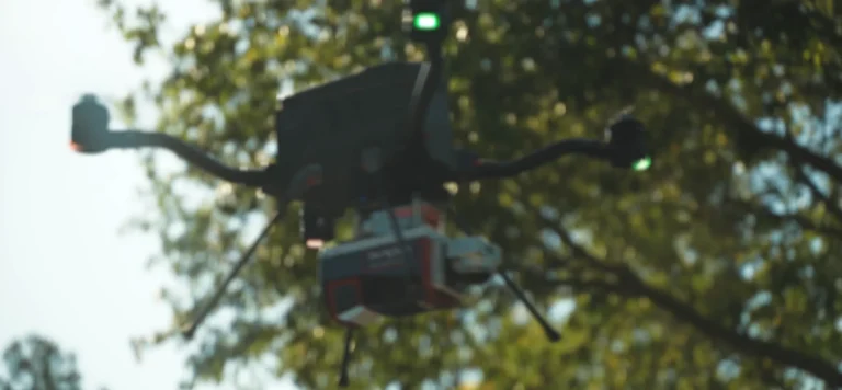 Harris Aerial Carrier H4C quadcopter in flight carrying the Phoenix LiDAR Ranger-U120 payload